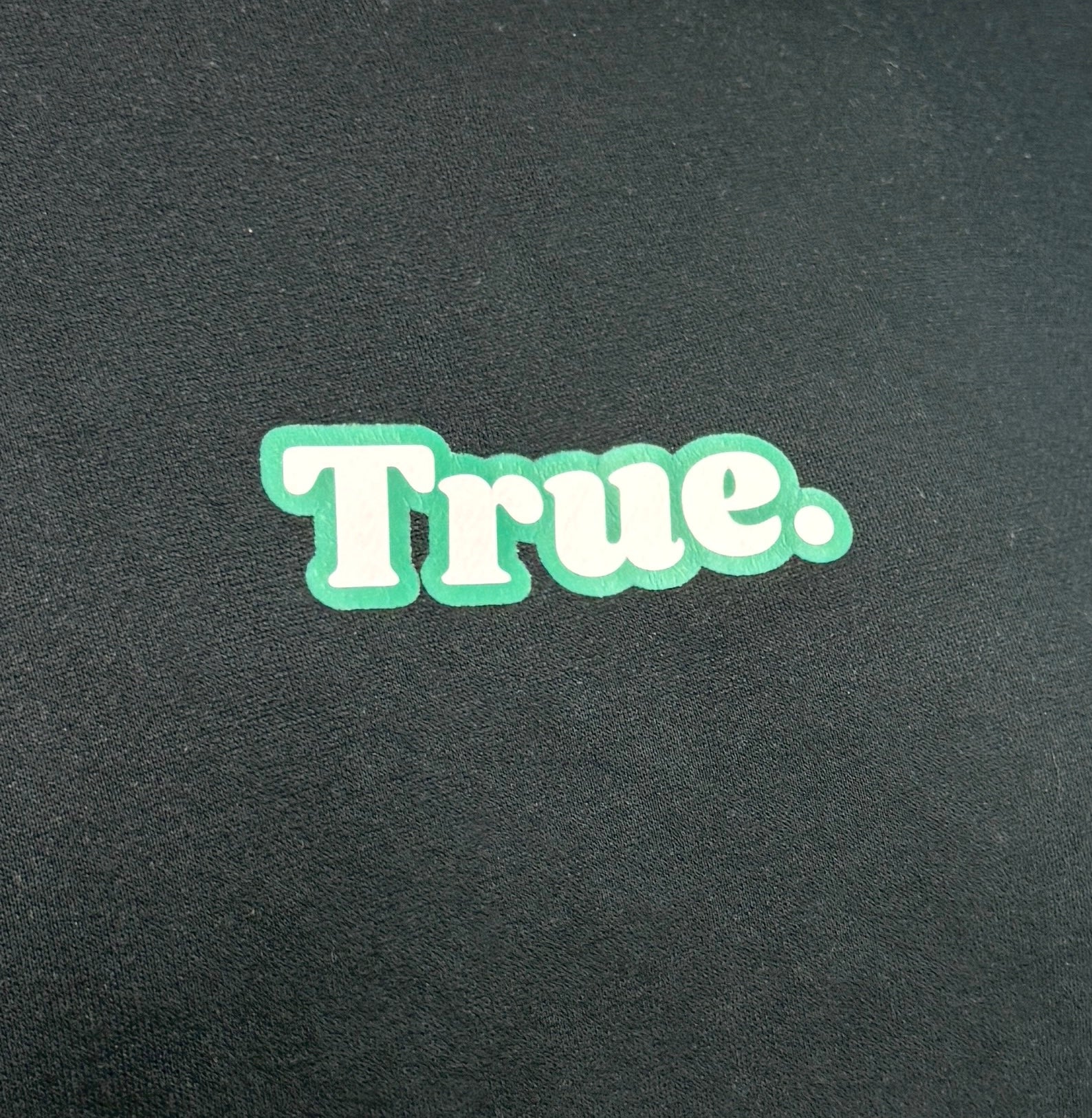 Oversized Black Fleece Unisex Hoodie with Green and White True. Design