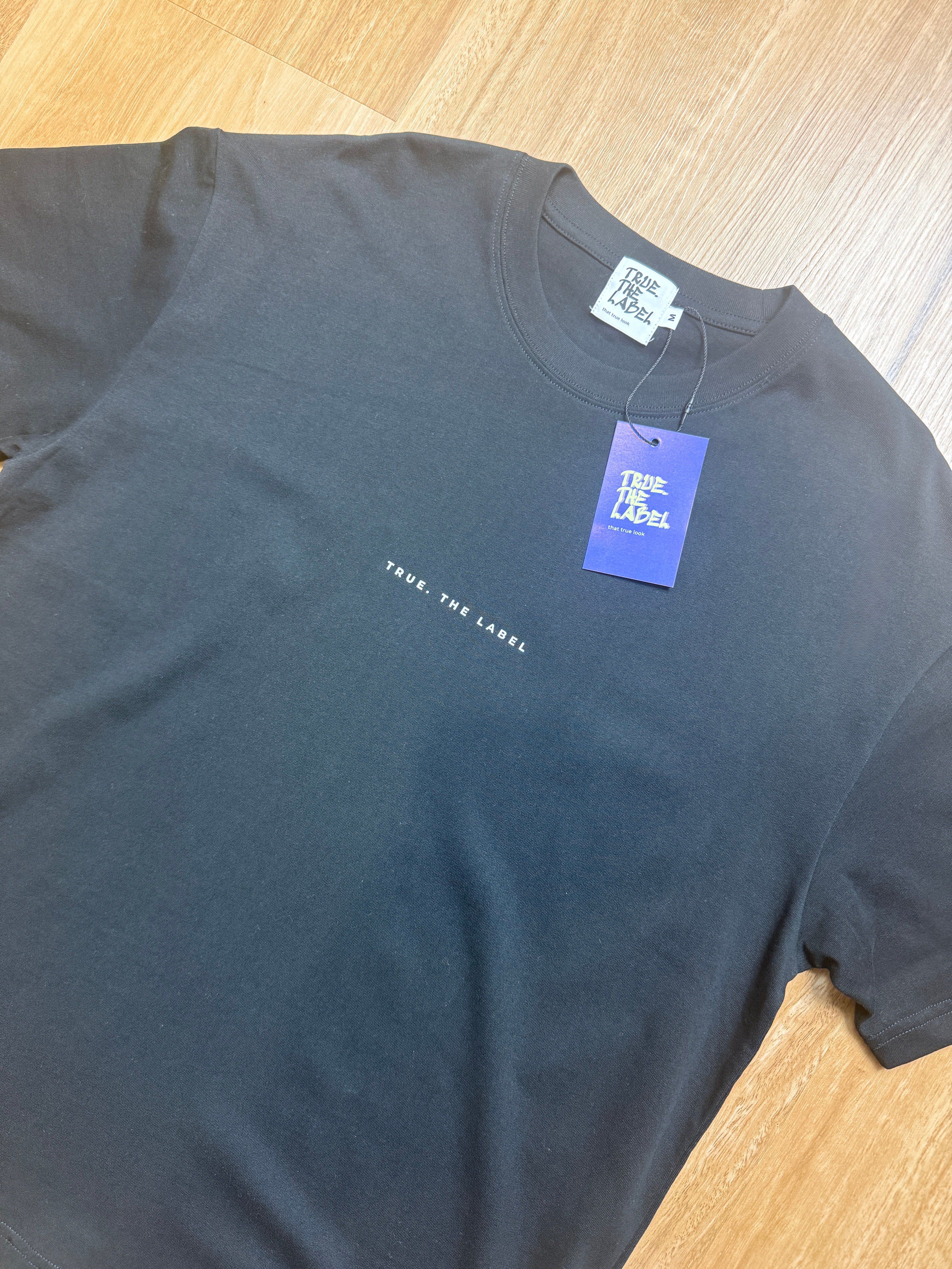 Unisex Classic Fit True. the Label Black Tee