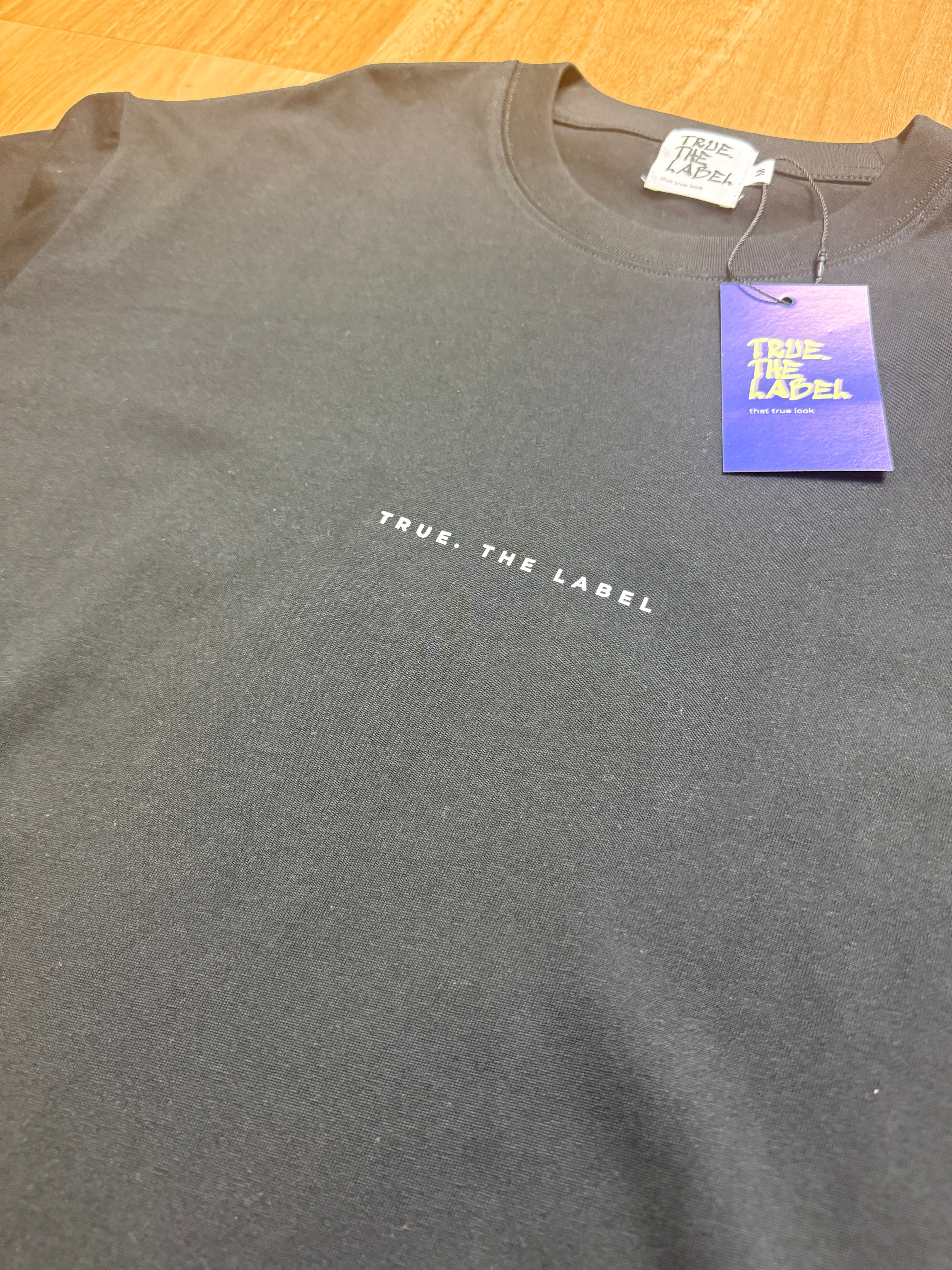 Unisex Classic Fit True. the Label Black Tee